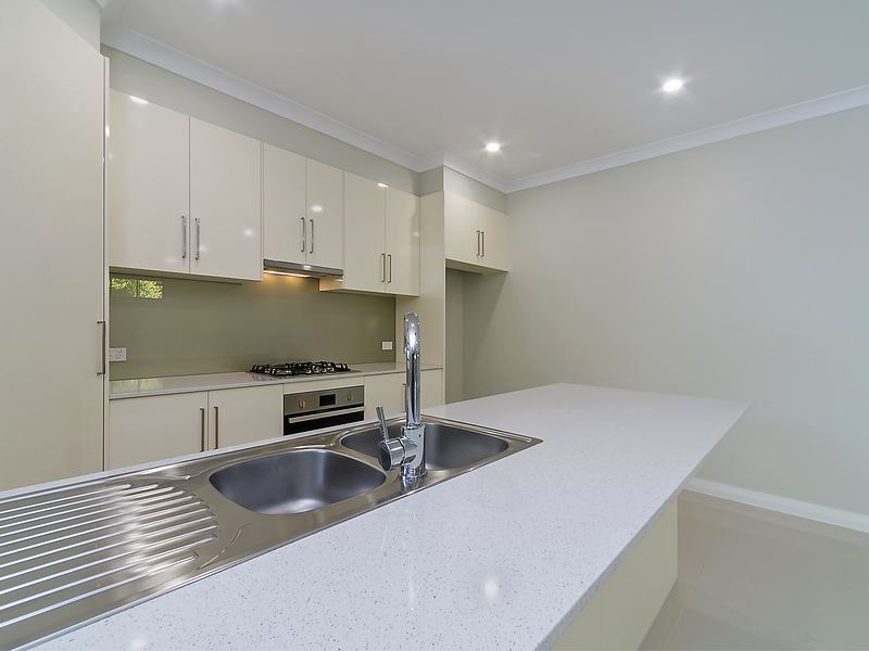 Kitchen plumbing fit-off with a double sink and gas cooktop at Gawler East