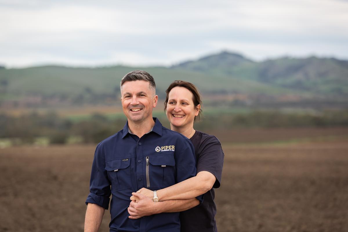Craig and Hayley from Piper Plumbing & Gas in a Barossa paddock