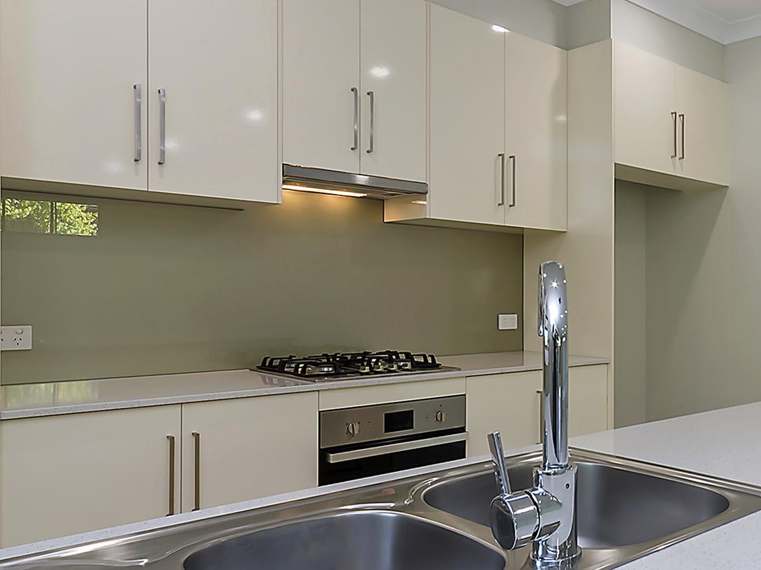 New kitchen at Gawler East with a gas cooktop, wall oven and double sink